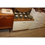 A laminate three drawer chest