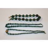 Two malachite necklaces and one other similar