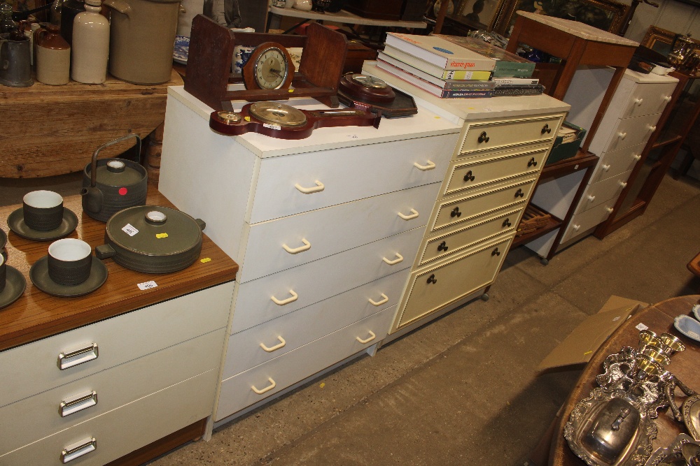 A white laminate chest of five drawers