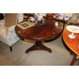 A Victorian mahogany snap top dining table