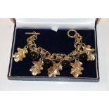 A heavy costume bracelet in the form of acorns and