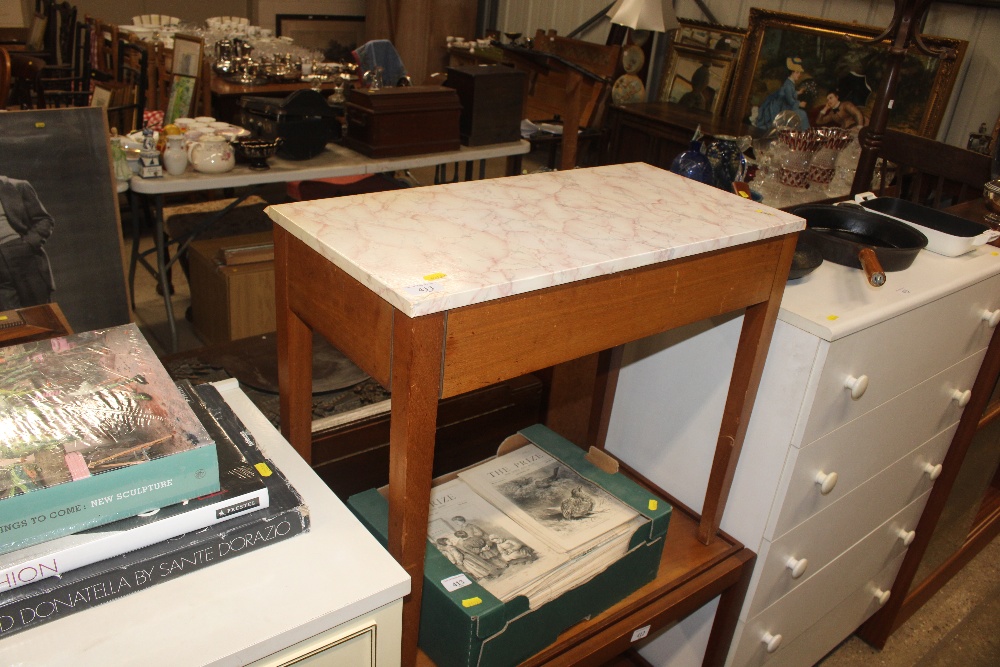 A teak and laminate sewing table and contents