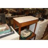 A teak and laminate sewing table and contents