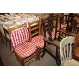 A set of six pine and rush seated ladder back kitc