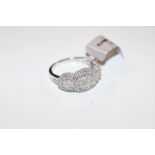 A 9ct white gold and chip diamond set ring