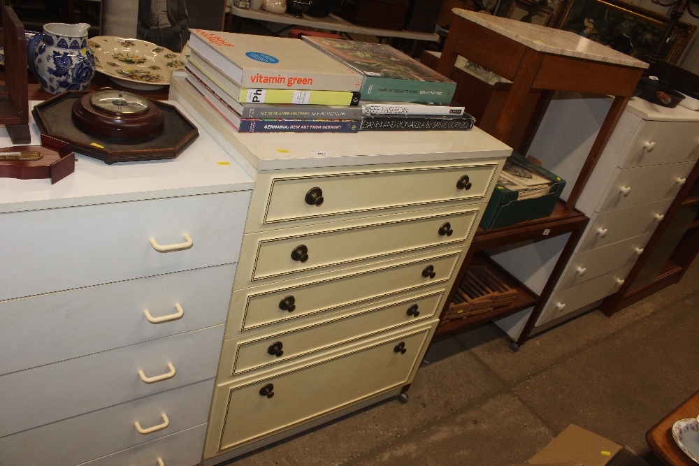 A laminate chest of five graduated drawers