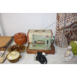 A Zephyr electric sewing machine with carry case