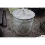 A galvanised water carrier bin with lid and twin h