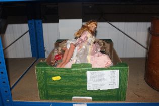 A box of various Barbie dolls etc