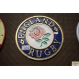 A circular painted cast iron sign for England Rugb