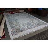 An approx. 12'5" x 9'2" floral pattern wool carpet