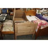 A pine sleigh bed