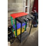 A plastic three tier shelf and a plastic tool stan