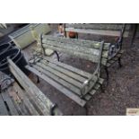 A wooden and metal two seater garden bench