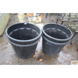 Four large plastic planters