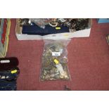 A bag of various military badges, buttons etc