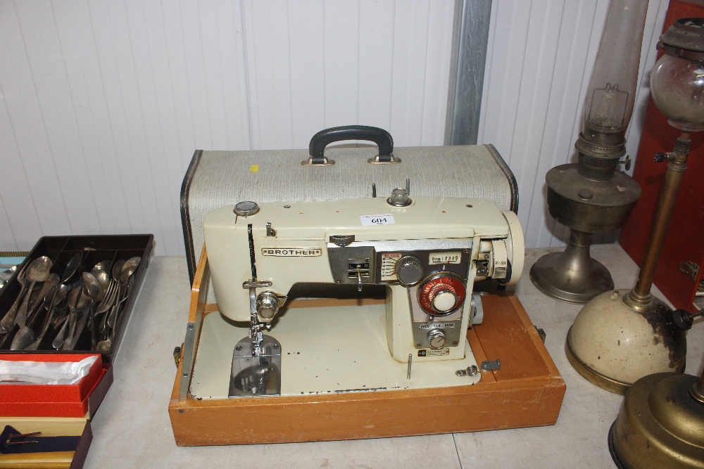 A Brother electric sewing machine in fitted carry