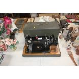 A Federation hand sewing machine with carry case