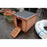 A small wooden pet hutch