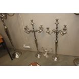 A pair of floor standing four branch candelabras,