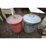 Two galvanised dust bins with lids