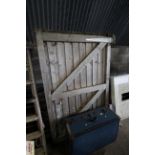 A wooden gate measuring approx. 47" wide x 70" tal