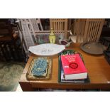 A kitchen notes board; books; egg crock; trivet st