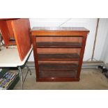 A mahogany open fronted bookcase