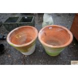 A pair of terracotta garden planters, measuring ap