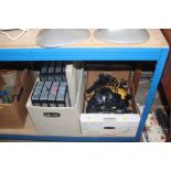 A box of various telephones and plastic storage bo