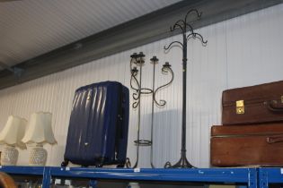 A metal coat rack together with a floor standing c