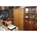 A light oak two door wardrobe