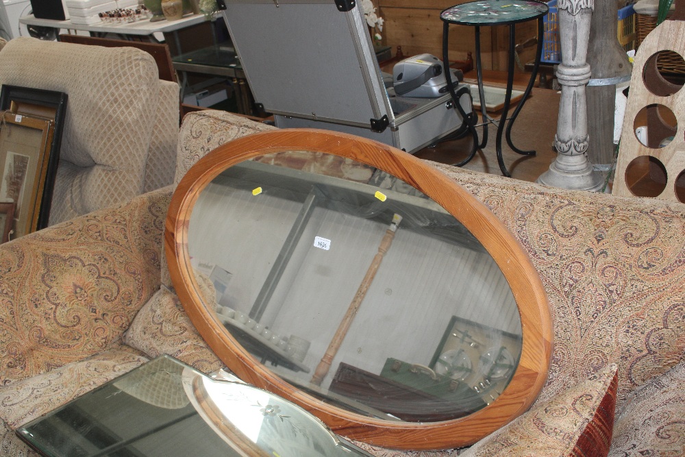 A pine oval wall mirror