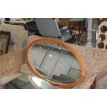 A pine oval wall mirror