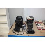 Two pairs of binoculars; various cameras; Polaroid