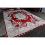 An approx. 12'10" x9'8" floral pattern wool carpet