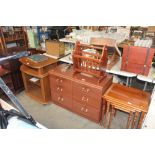 A pair of wood effect bedside chests fitted three