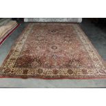An approx. 10'7" x 7'11" floral pattern rug