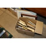 A box containing pictures and prints