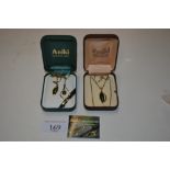 Two boxed 22ct gold plated and nephrite jade penda