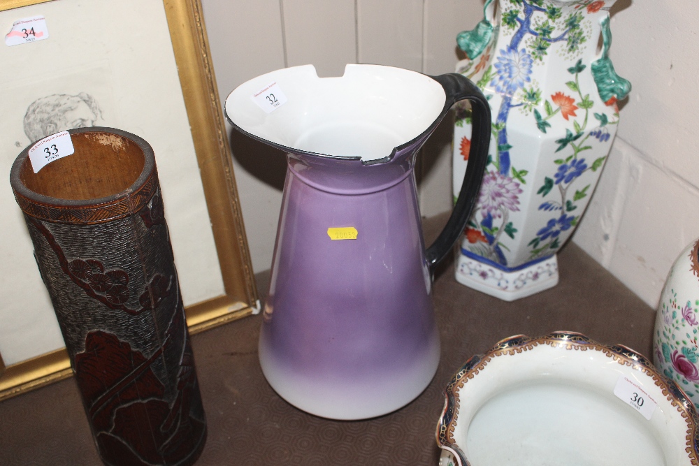 A purple glazed wash jug