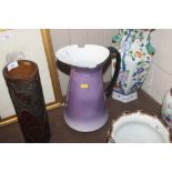 A purple glazed wash jug