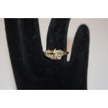 A yellow metal and diamond set cluster ring, ring