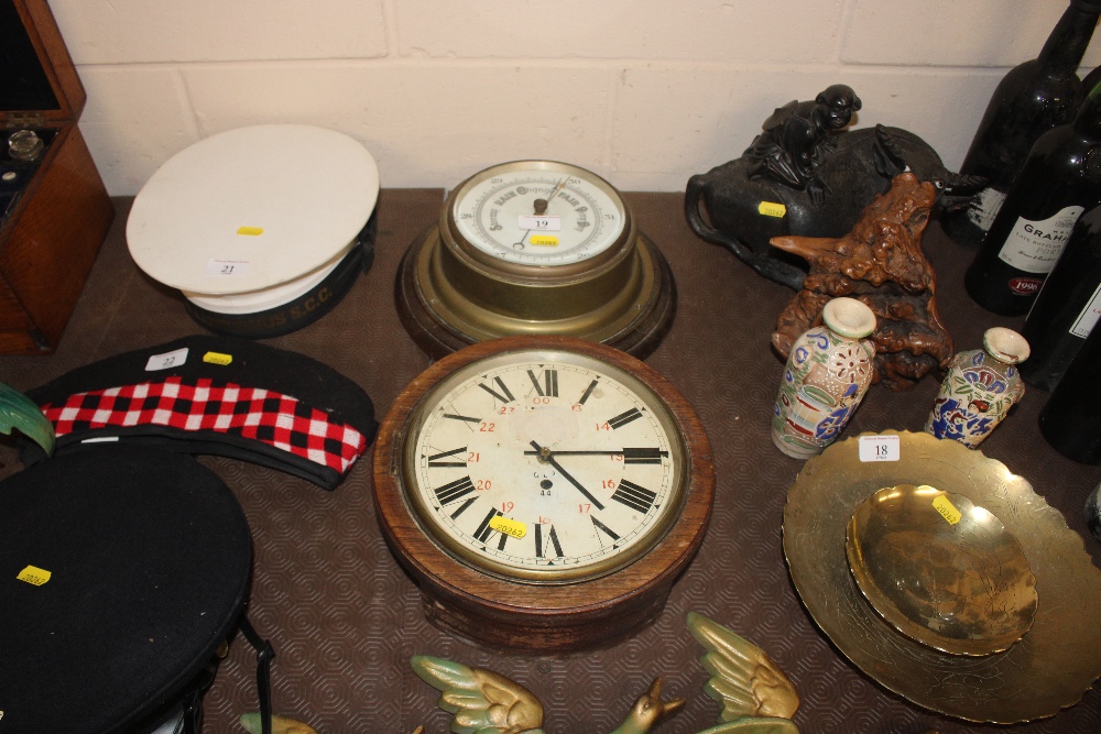 A brass cased ships style barometer and a circular