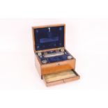 A 19th Century oak cased travelling toilet box by