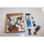 A box of mixed badges and medals etc.