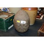 A Chinese stoneware Buddha head