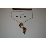 A Sterling silver belcher link chain with amber be