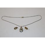 A silver gilt necklace and matching ear rings