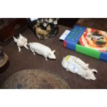 Three Beswick models of pigs